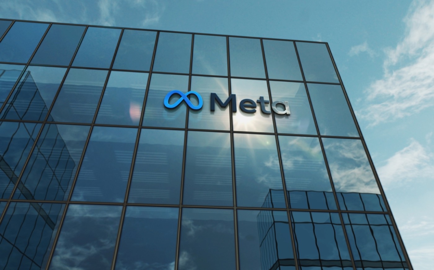 The Meta logo on the side of a glass office building