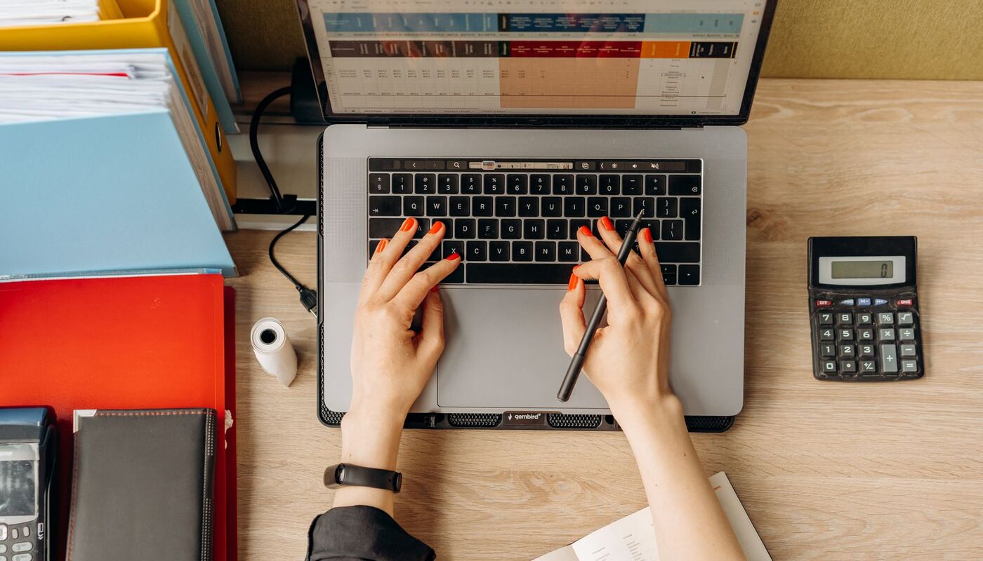 A person checking a news story on a laptop