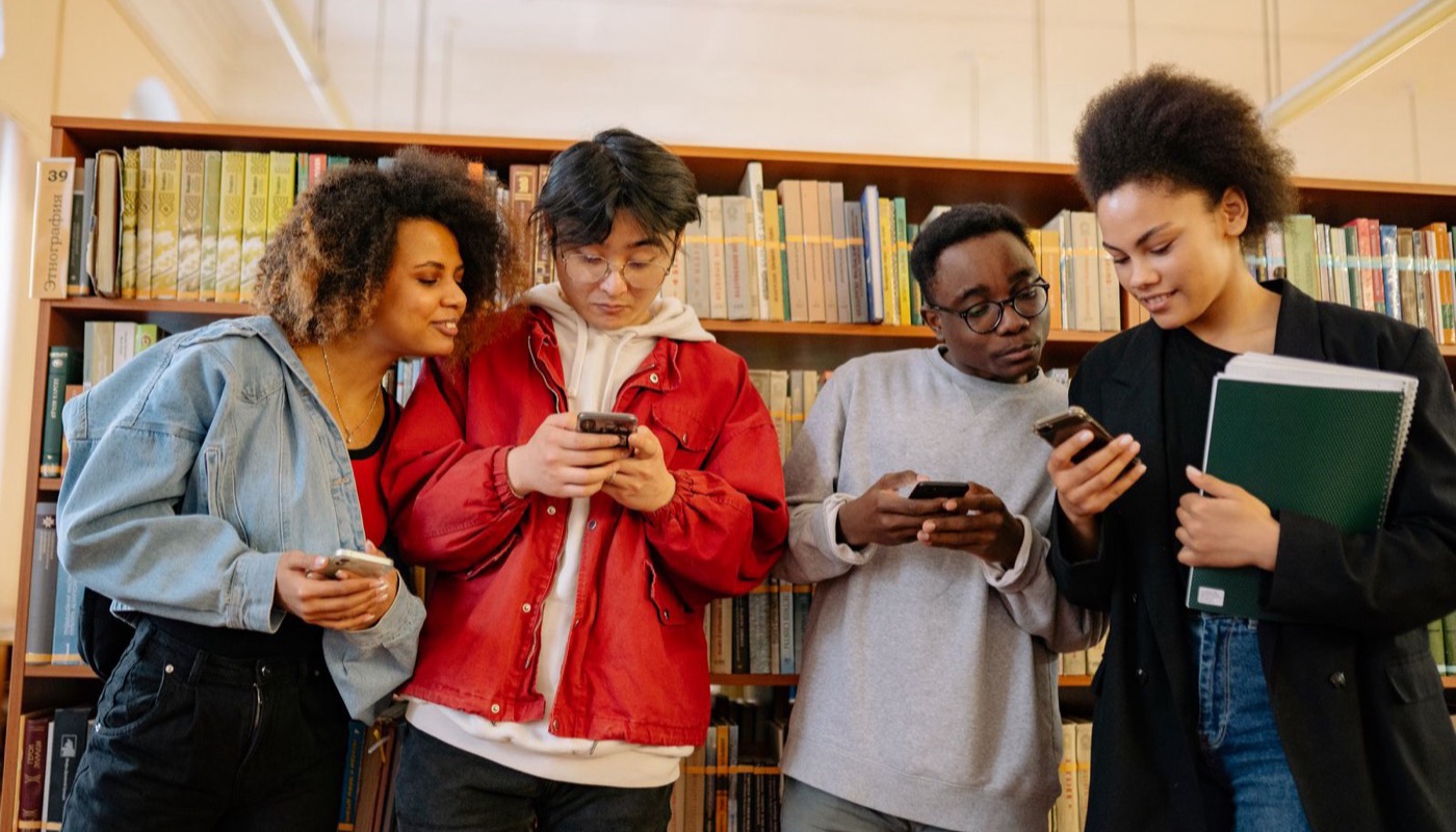 A group of readers looking at their phones