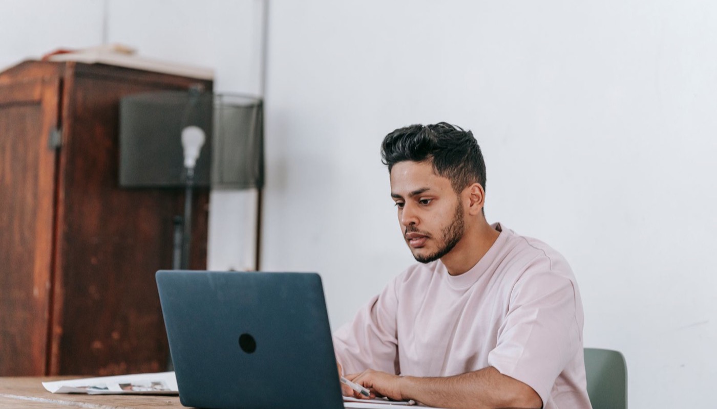 A journalist working at a laptop