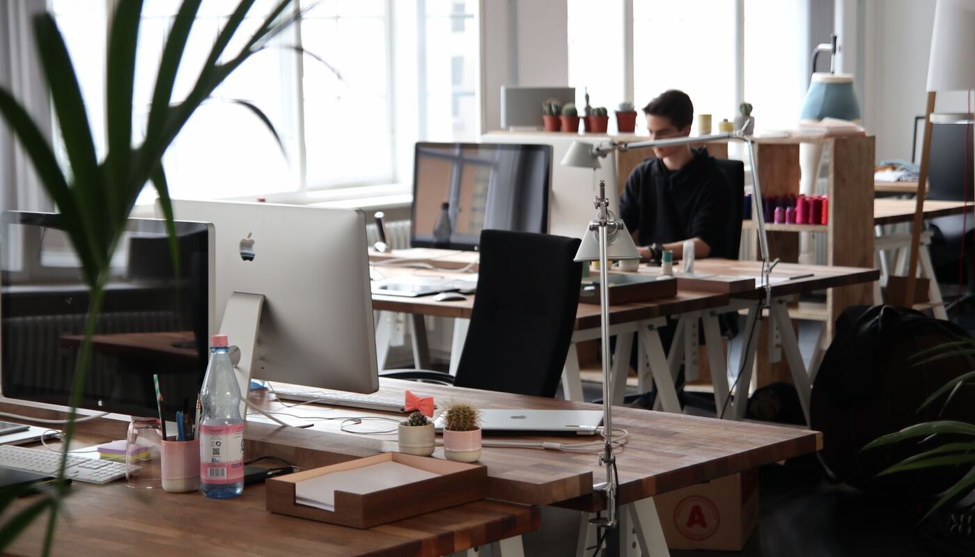 A person working at a computer in an office
